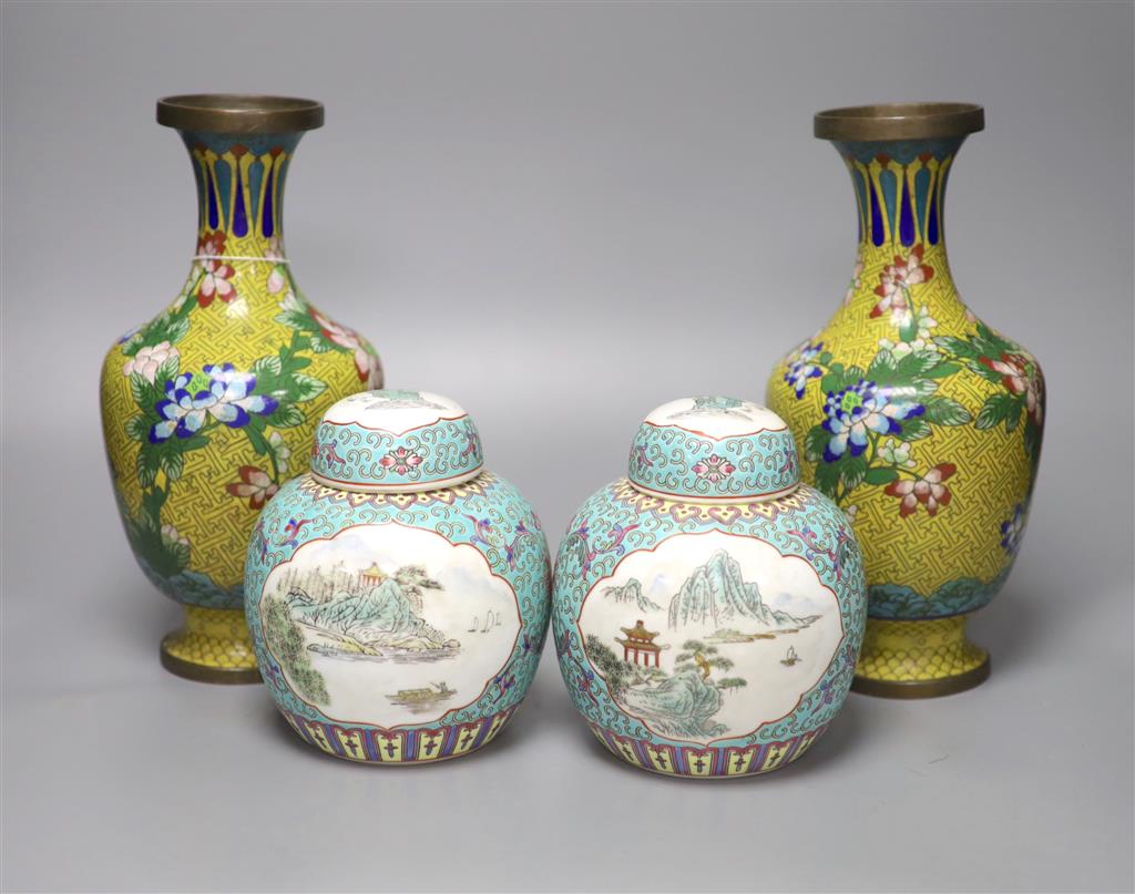 A pair of 20th century Chinese export ginger jars, decorated with vignettes of landscapes over a blue ground, 16 cm high, together with